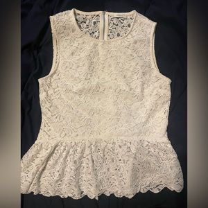 Talula lace peplum top. Lined at front. Zipper back.